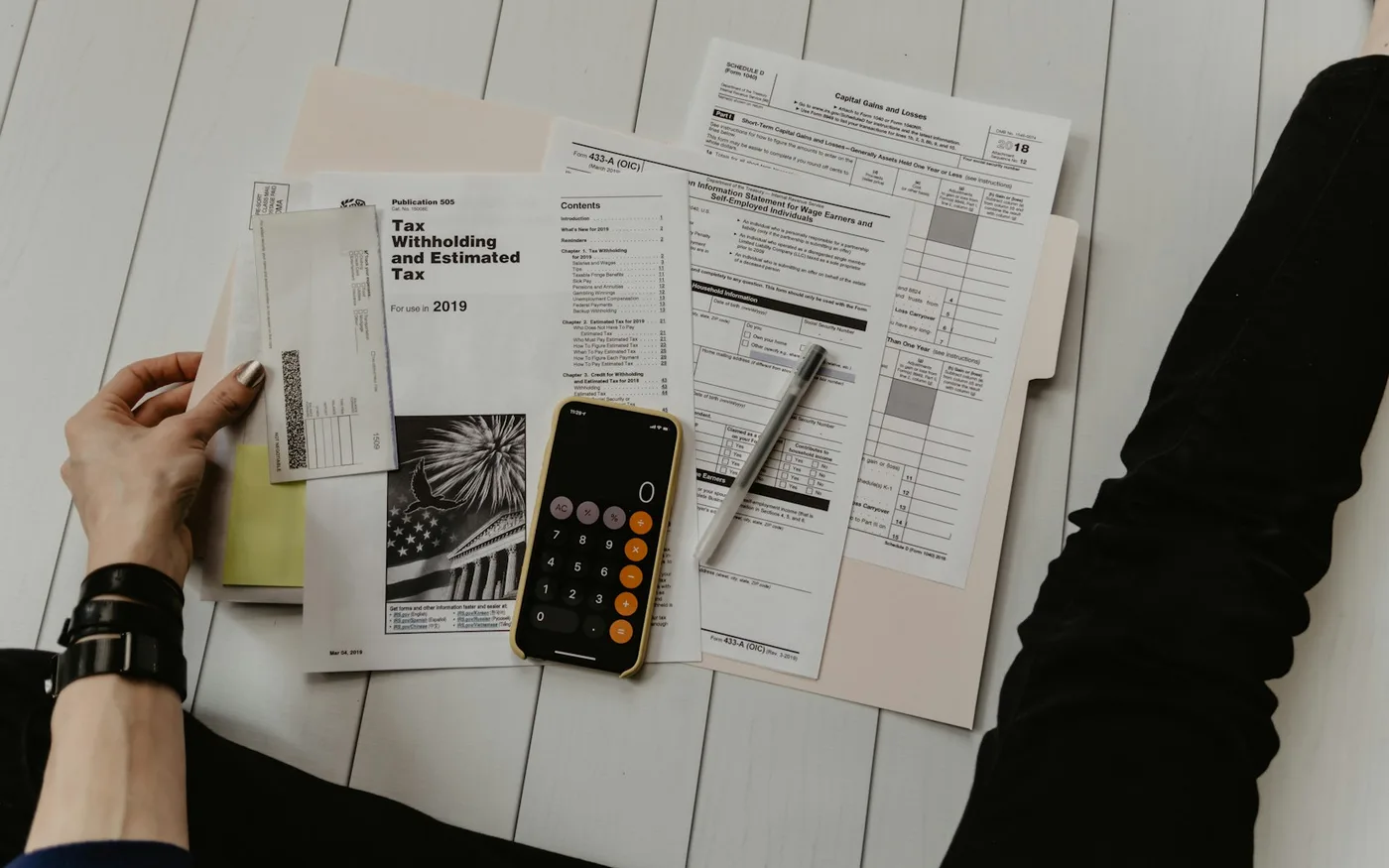Banking documents and calculator on a desk