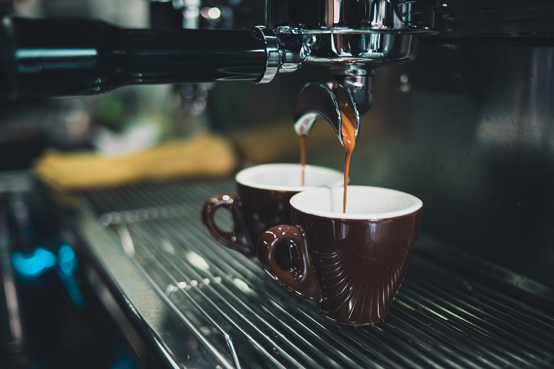 Espresso being poured into two cups
