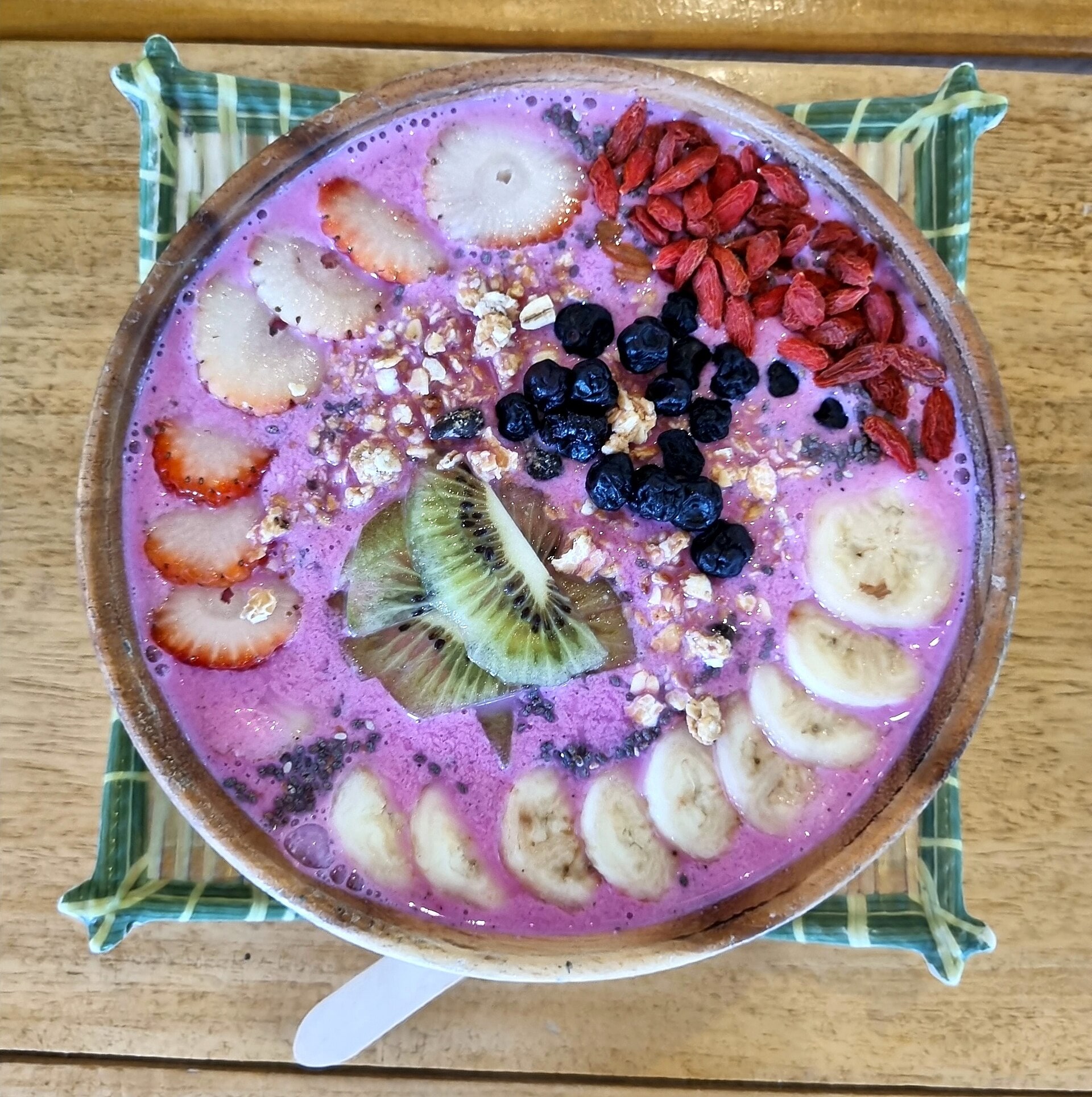 A tropical smoothie bowl at a cafe-style breakfast