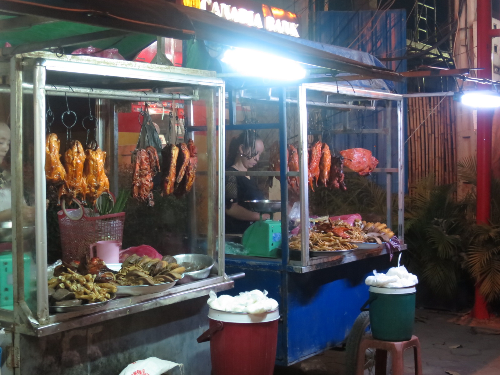 A Siem Reap street-food stall with grilled meat and noodles