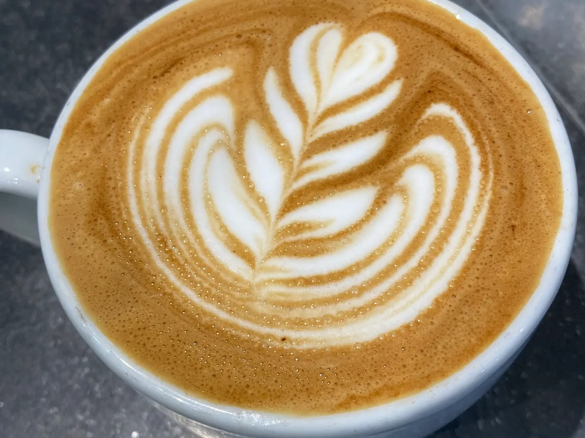 Close-up latte art in a milk coffee