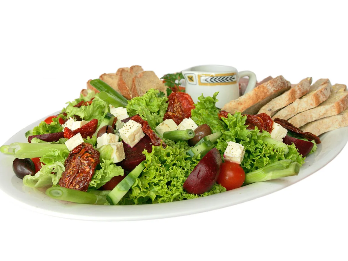 Fresh salad bowl with vegetables and bread