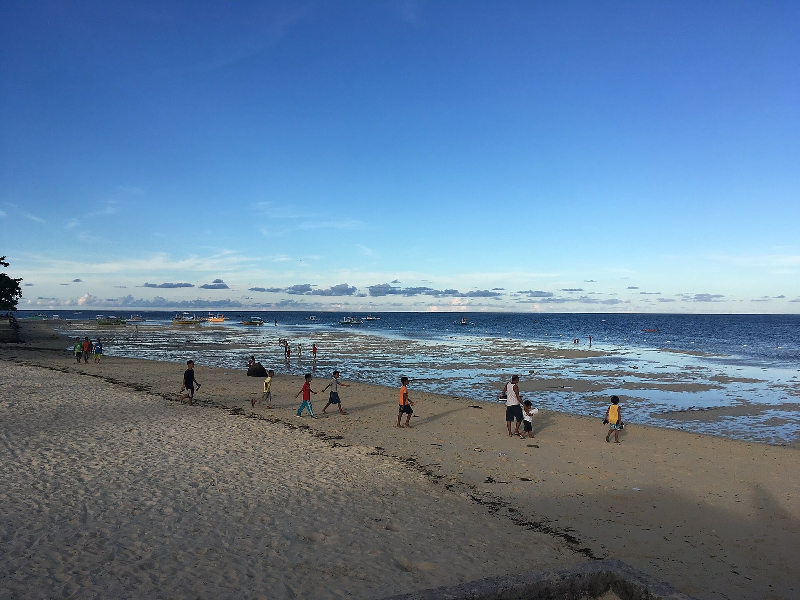 People on the beach at General Luna